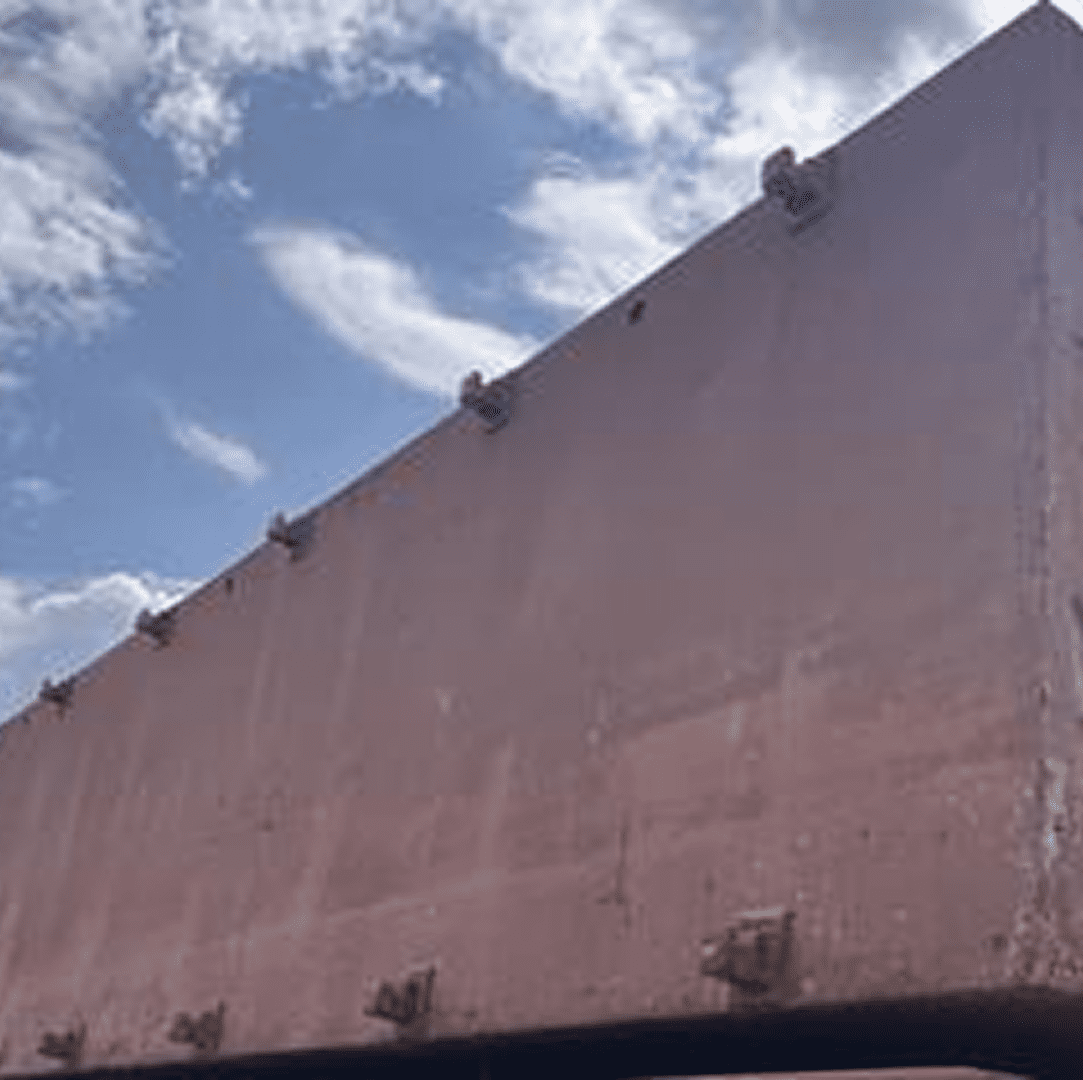 Weathered industrial structure under blue sky