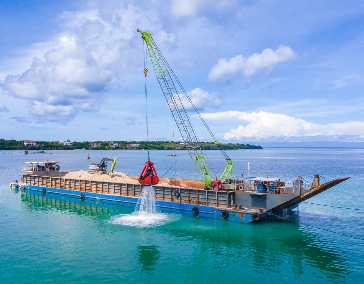 Large barge transporting sand and gravel